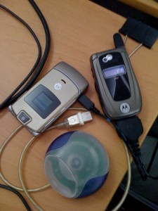 loca_cells LocaModa's test cell phones. Shown with original iMac puck mouse to illustrate age of technology.